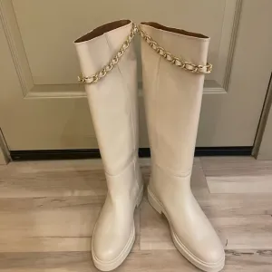Alohas brand off white/beige leather boots.