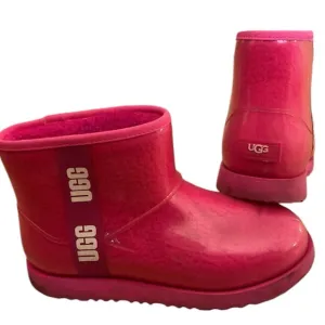 Ugg brand rain/winter boots, worn about 3 x. Hot pink size 6Y